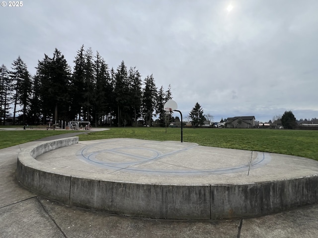 view of home's community featuring a lawn and community basketball court