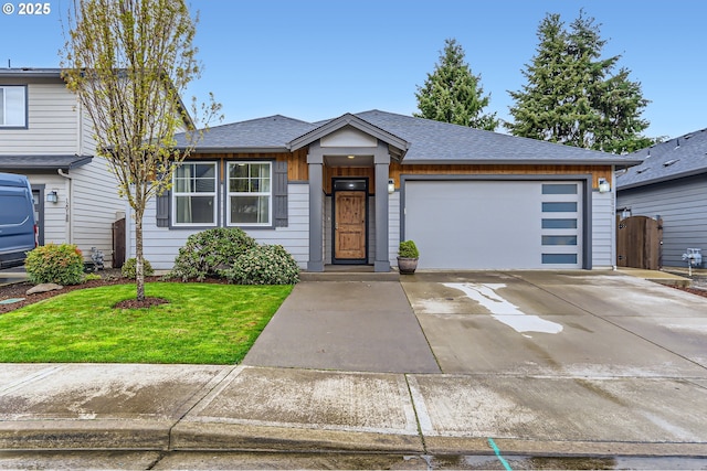 12024 NE 109th St, Vancouver, WA 98662 - view of front facade with a front yard, a shingled roof, an attached garage, fence, and driveway