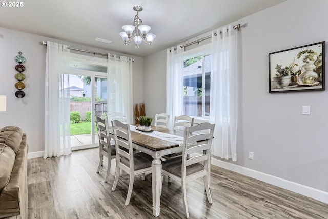 12024 NE 109th St, Vancouver, WA 98662 - dining room with light wood finished floors, an inviting chandelier, and a healthy amount of sunlight