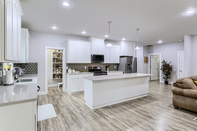 12024 NE 109th St, Vancouver, WA 98662 - kitchen featuring a sink, light countertops, white cabinetry, and stainless steel appliances