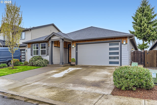 12024 NE 109th St, Vancouver, WA 98662 - view of front of property with an attached garage, a shingled roof, driveway, and fence