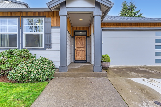 12024 NE 109th St, Vancouver, WA 98662 - property entrance with a garage and concrete driveway