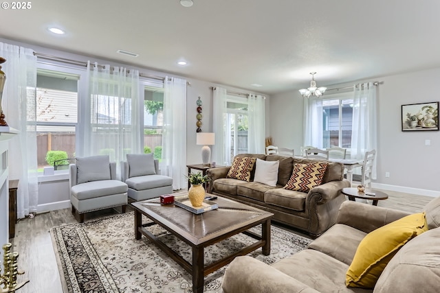 12024 NE 109th St, Vancouver, WA 98662 - living area featuring light wood-type flooring, an inviting chandelier, baseboards, and recessed lighting