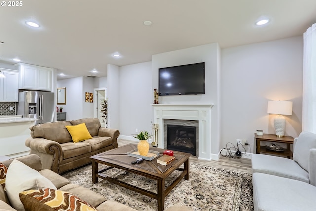 12024 NE 109th St, Vancouver, WA 98662 - living area with a glass covered fireplace, recessed lighting, and light wood finished floors