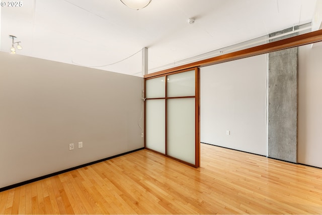 333 NW 9th Ave Unit 902, Portland, OR 97209 - unfurnished bedroom with light wood-style flooring