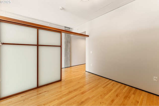 333 NW 9th Ave Unit 902, Portland, OR 97209 - unfurnished bedroom with hardwood / wood-style floors
