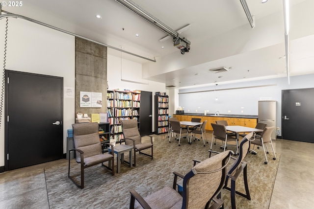 333 NW 9th Ave Unit 902, Portland, OR 97209 - living room featuring finished concrete flooring and a high ceiling
