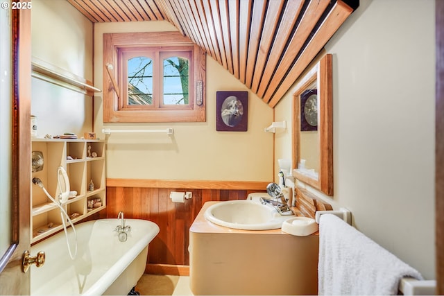 bathroom with a freestanding tub, wood ceiling, vanity, and lofted ceiling