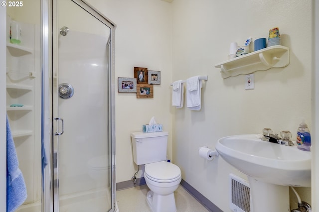 bathroom featuring baseboards, a stall shower, toilet, and visible vents