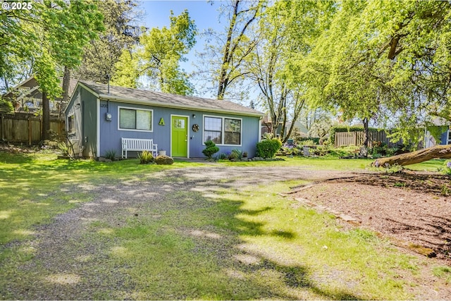 view of outbuilding featuring fence