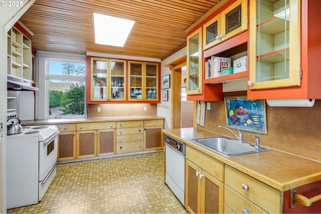 kitchen with a sink, wooden ceiling, light countertops, under cabinet range hood, and white appliances