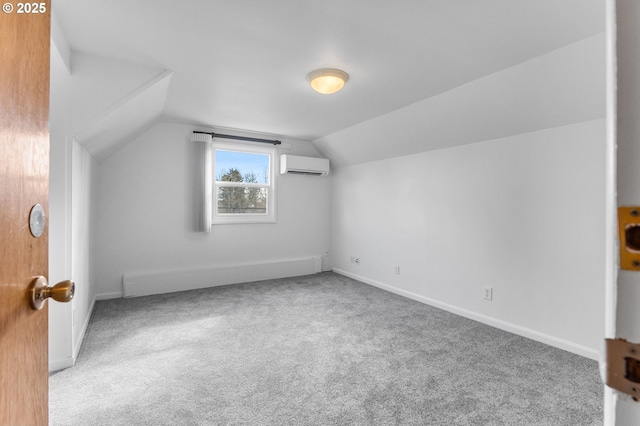 bonus room with carpet flooring, an AC wall unit, baseboards, and vaulted ceiling