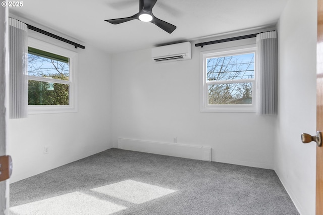 carpeted empty room featuring ceiling fan and a wall unit AC