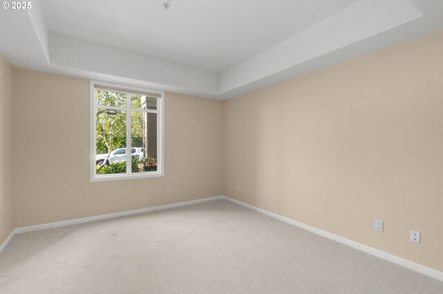 4873 NW Promenade Ter Unit 122, Portland, OR 97229 - unfurnished room featuring light colored carpet and a tray ceiling