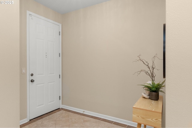 4873 NW Promenade Ter Unit 122, Portland, OR 97229 - foyer entrance featuring baseboards and light tile patterned floors