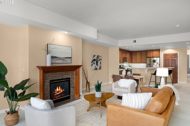 4873 NW Promenade Ter Unit 122, Portland, OR 97229 - living area with a fireplace with flush hearth, light carpet, and recessed lighting