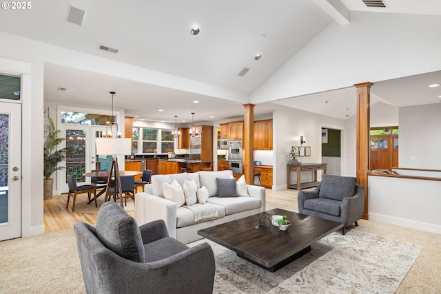 19375 SW Eastside Rd, Lake Oswego, OR 97034 - living room with ornate columns, recessed lighting, light colored carpet, baseboards, and beam ceiling