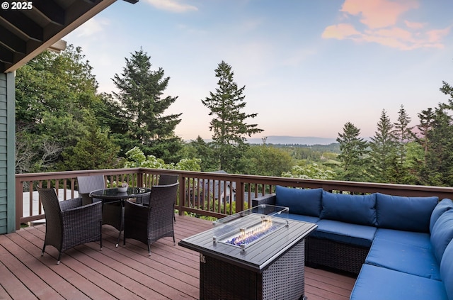 19375 SW Eastside Rd, Lake Oswego, OR 97034 - deck at dusk with an outdoor living space with a fire pit and outdoor dining area