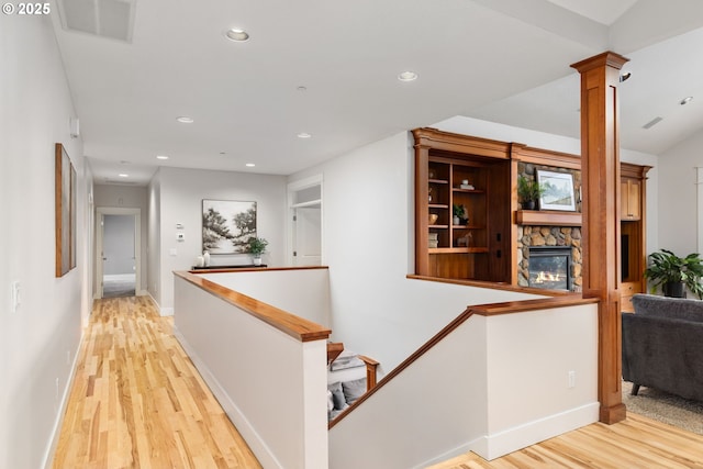 19375 SW Eastside Rd, Lake Oswego, OR 97034 - hallway with light wood finished floors, an upstairs landing, recessed lighting, baseboards, and ornate columns