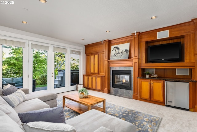 19375 SW Eastside Rd, Lake Oswego, OR 97034 - living room with plenty of natural light, light carpet, a tile fireplace, and recessed lighting