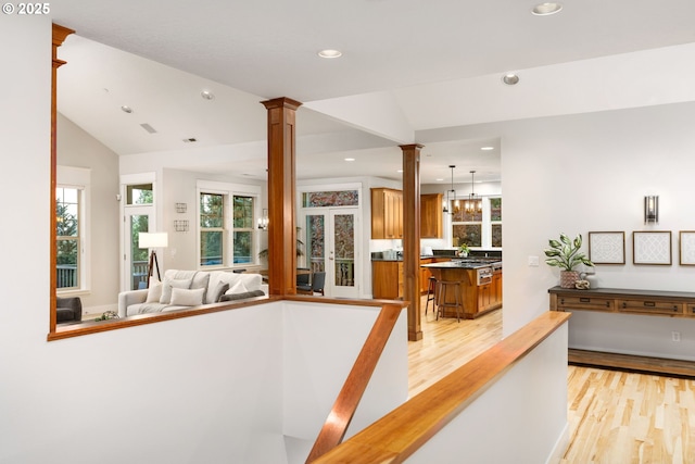 19375 SW Eastside Rd, Lake Oswego, OR 97034 - hallway with decorative columns, light wood finished floors, recessed lighting, and lofted ceiling