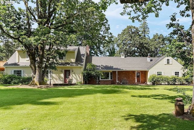 4269 Victor Point Rd, Silverton, OR 97381 - view of front facade with a front lawn, a chimney, a shingled roof, and brick siding