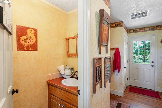 4269 Victor Point Rd, Silverton, OR 97381 - bathroom featuring wood finished floors, vanity, and a textured ceiling