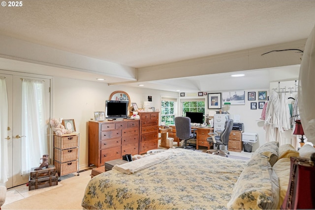 4269 Victor Point Rd, Silverton, OR 97381 - bedroom with french doors, a desk, recessed lighting, a textured ceiling, and light carpet