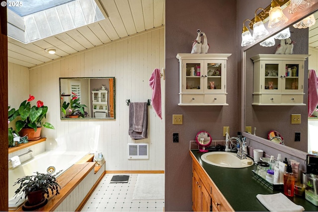4269 Victor Point Rd, Silverton, OR 97381 - bathroom with a skylight, a whirlpool tub, vanity, wood ceiling, and vaulted ceiling