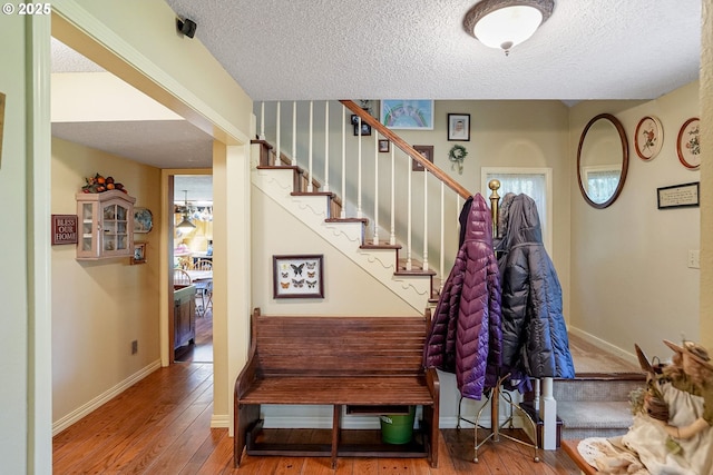 4269 Victor Point Rd, Silverton, OR 97381 - stairway with a textured ceiling and hardwood / wood-style floors