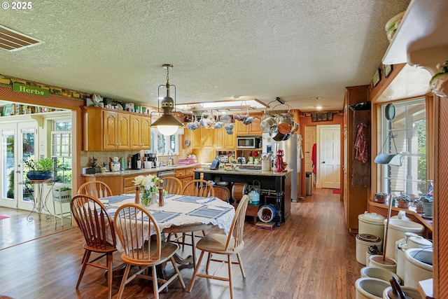 4269 Victor Point Rd, Silverton, OR 97381 - dining room with wood finished floors and a textured ceiling