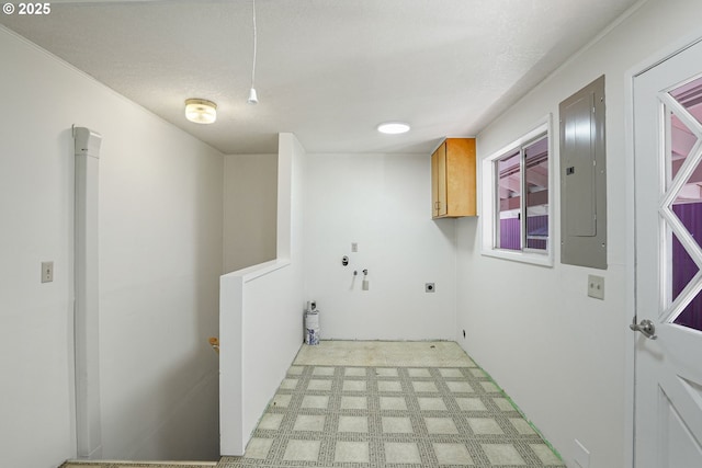 laundry room featuring cabinets, electric panel, hookup for a washing machine, and electric dryer hookup