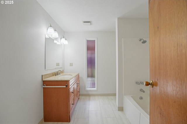 bathroom featuring vanity and shower / washtub combination