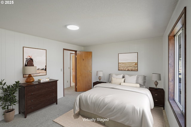 carpeted bedroom with a textured ceiling