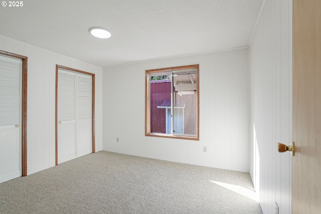 unfurnished bedroom featuring carpet