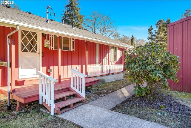 entrance to property featuring a deck