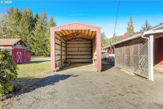 view of outbuilding featuring a lawn