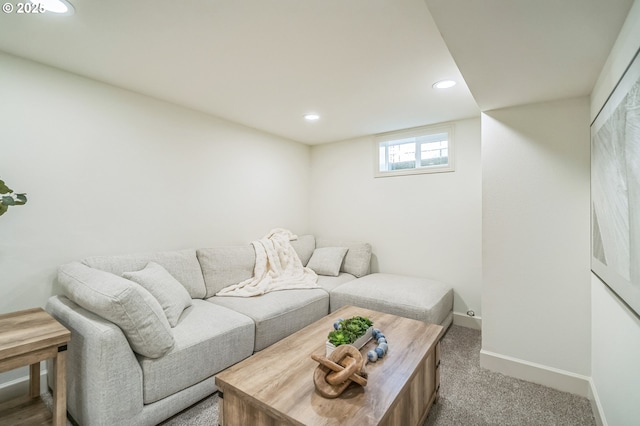 living area with baseboards, recessed lighting, and carpet