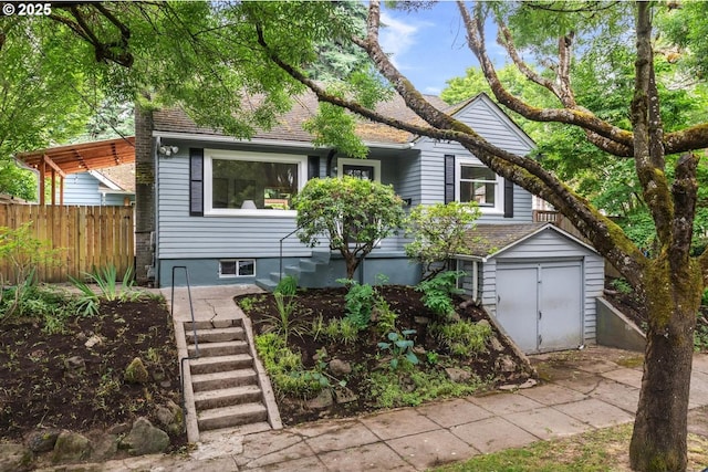 1526 SE Claybourne St, Portland, OR 97202 - view of front facade with a garage, stairway, and a shingled roof