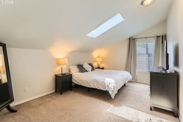 319 NE Hyde Cir, Hillsboro, OR 97124 - bedroom featuring a skylight, lofted ceiling, carpet floors, and baseboards