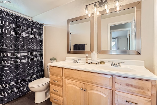 319 NE Hyde Cir, Hillsboro, OR 97124 - full bath with double vanity, toilet, tile patterned flooring, and a shower with shower curtain