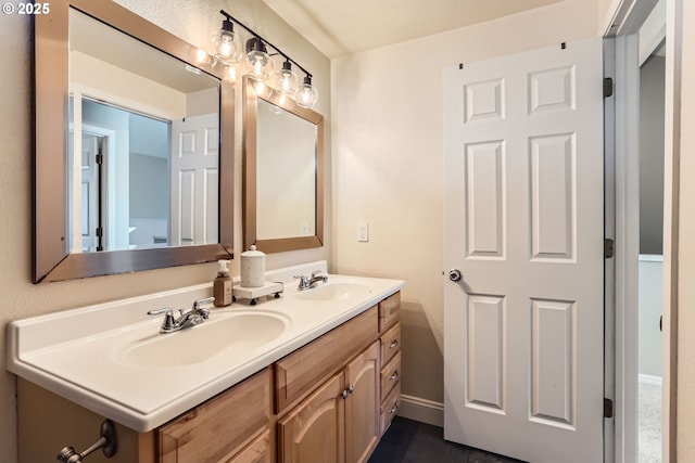 319 NE Hyde Cir, Hillsboro, OR 97124 - bathroom featuring double vanity and baseboards