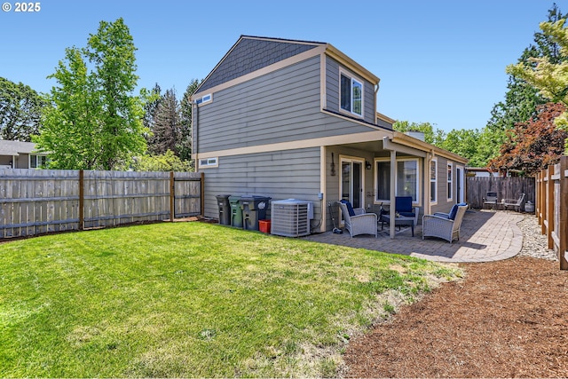 319 NE Hyde Cir, Hillsboro, OR 97124 - back of property featuring central AC and a patio