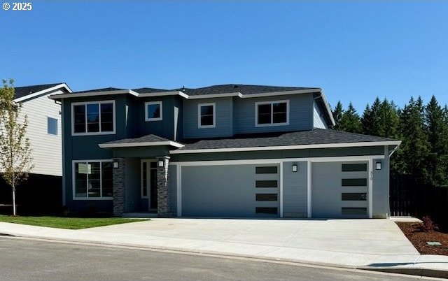 310 W 20th Way, La Center, WA 98629 - prairie-style home with concrete driveway and a garage