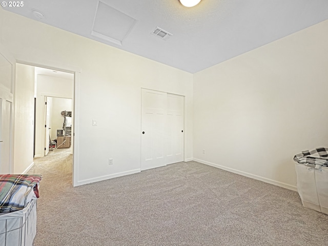 7205 Edge Cliff Dr, Brookings, OR 97415 - unfurnished bedroom featuring carpet flooring, attic access, and baseboards