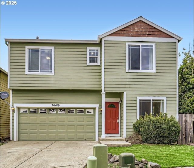 view of front of home with driveway and an attached garage