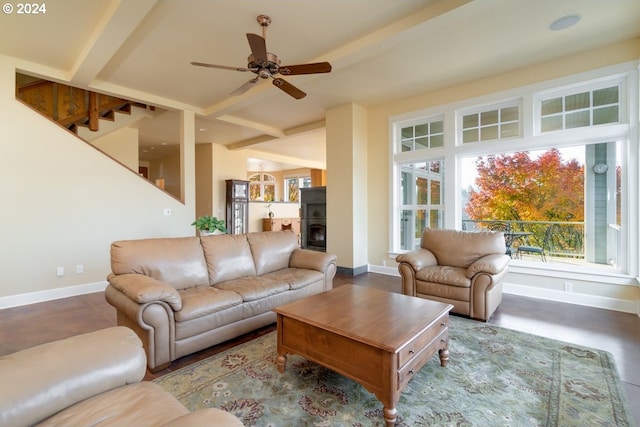 living room with ceiling fan and beam ceiling