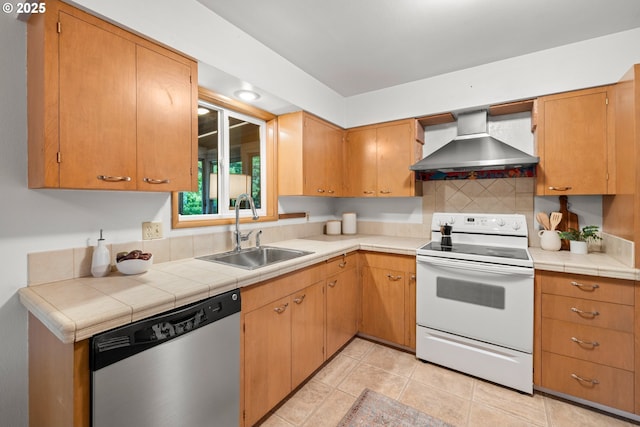 kitchen with white electric range oven, wall chimney exhaust hood, a sink, dishwasher, and tasteful backsplash