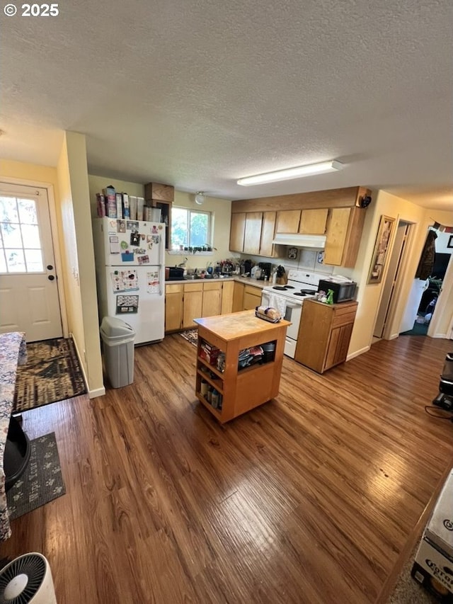 815 Nyssa St, Junction City, OR 97448 - kitchen with a textured ceiling, dark wood-style floors, and white appliances