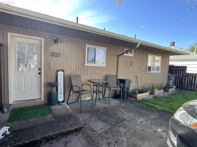 815 Nyssa St, Junction City, OR 97448 - rear view of house with a patio area and fence